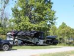 View larger image of Motorhome parking under tall tree at BRANCHES OF NIAGARA CAMPGROUND  RESORT image #9