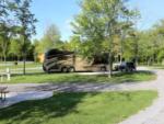 View larger image of Tag axle motorhome in campsite with two vehicle at BRANCHES OF NIAGARA CAMPGROUND  RESORT image #11
