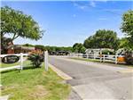 View larger image of The entrance with a white fence at NORTHLAKE VILLAGE RV PARK image #5