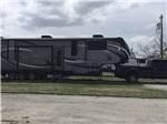 The side view of a fifth wheel trailer at HOOVES N' WHEELS RV PARK & HORSE MOTEL - thumbnail