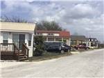 A row of rental manufactured homes at HOOVES N' WHEELS RV PARK & HORSE MOTEL - thumbnail