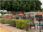 View larger image of The fenced in pool area at SHADY ACRES MH  RV PARK image #3