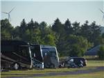 View larger image of A row of motorhomes and a motorcycle at CIDER HOUSE CAMPGROUND image #9