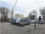 RVs parked with picnic benches at APPLEWOOD RV RESORT BY RJOURNEY - thumbnail