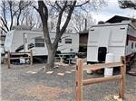 Travel trailers parked in gravel sites at APPLEWOOD RV RESORT BY RJOURNEY - thumbnail