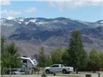 RVs parked near a mountain backdrop at ROUND VALLEY PARK - thumbnail