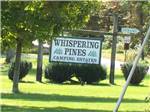 The front entrance sign at WHISPERING PINES CAMPING ESTATES - thumbnail