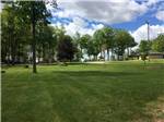 A grassy area with a picnic bench at THE HILL CAMPGROUND - thumbnail