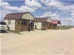 A row of rental cabins at EL RANCHO VILLAGE RV & CABINS - thumbnail