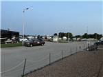 Vehicles and RVs parked at paved sites at Air Capital RV Park - thumbnail