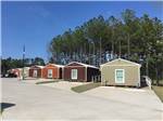 View larger image of A row of rental cabins at BLUE SKY LAKE LIVINGSTON RV PARK  CABINS image #4
