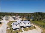 An aerial view of the main building and RV sites at BLUE SKY LAKE LIVINGSTON RV PARK & CABINS - thumbnail