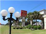 View larger image of A light post in front of the suites at WINNIE INN  RV PARK image #1