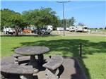 View larger image of A concrete picnic table at WINNIE INN  RV PARK image #10