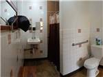 View larger image of The clean bathroom and shower stall at TRADEWINDS RV PARK image #6