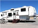 View larger image of A fifth wheel trailer in a RV site at TRADEWINDS RV PARK image #7