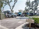 Trailers and motorhomes parked in RV sites at SANTA ROSA WATERFRONT RV RESORT - thumbnail