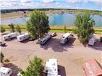 View larger image of RVs on spacious sites near pond at WAKESIDE LAKE RV PARK image #7
