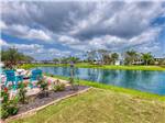 View larger image of A body of water in a lush grassy resort at SOUTHERN OAKS RV RESORT image #1