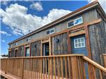 Wooden building with wooden deck at Middlefork RV Resort - thumbnail