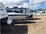 Boat parked between RVs at Middlefork RV Resort - thumbnail