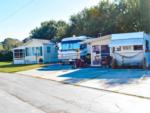 Mobile homes and RV parked at Tropical Gardens RV Park - thumbnail
