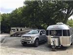 View larger image of Trailers under trees in RV sites at WALNUT GROVE RV PARK image #5