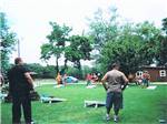 People playing corn hole at HANSEN'S HIDEAWAY RANCH & FAMILY CAMPGROUND - thumbnail