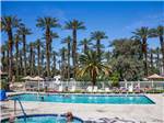 View larger image of Swimming pool with outdoor seating at PALM SPRINGS RV RESORT image #6