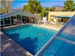 Woman swimming in the outdoor pool at PREFERRED RV RESORT - thumbnail