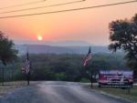 Park entrance at sunset at LAKE MEDINA RV RESORT - thumbnail