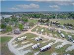 View larger image of View of campsites with water in background at WATERS EDGE RV RESORT image #5