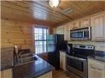 View larger image of Interior view of kitchen at WATERS EDGE RV RESORT image #7