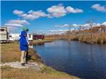 View larger image of People fishing near RV sites at NORTH LANDING BEACH RV RESORT  COTTAGES image #9