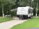 Parked trailer next to panic table at Ozark Outdoors/Riverfront Resort - thumbnail