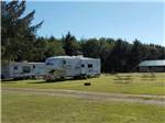 View larger image of Trailers parked in grassy RV sites at KENANNA RV PARK image #8