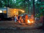 Generational photo of family around a campfire at  Lakeside Pines Campground - thumbnail