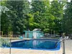 View larger image of Pool with green tall trays in the background at CHAIN OLAKES CAMPGROUND image #3
