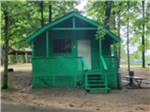 View larger image of Bright green exterior of cabin at CHAIN OLAKES CAMPGROUND image #11