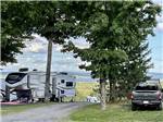A gravel road between two RV sites at LAKEVIEW CAMPING RESORT - thumbnail