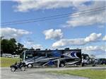 An ATV in front of a large motorhome at LAKEVIEW CAMPING RESORT - thumbnail
