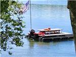 A pontoon boat that looks like a picnic table at DUNROAMIN' TRAILER PARK & COTTAGES - thumbnail