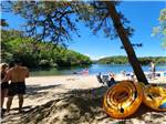 People hanging out at the beach at DUNROAMIN' TRAILER PARK & COTTAGES - thumbnail