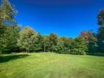 Open grass area at Tiny Village Ottawa River - thumbnail