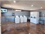 Laundry room with silver corrugated wainscoting at RUSTIC MEADOWS RV PARK - thumbnail