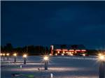 Lighted vacant sites at night at RUSTIC MEADOWS RV PARK - thumbnail