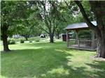 View larger image of A grassy area with a gazebo at NICOLSTON DAM CAMPGROUND  TRAVELLERS PARK image #3