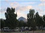 View larger image of The RV sites with a mountain in the background at SLEEPING UTE RV PARK image #11