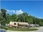 Camper in sunny campsite at HIDDEN PARADISE CAMPGROUND - thumbnail