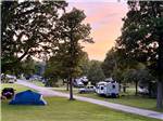 RVs parked in grass sites - thumbnail